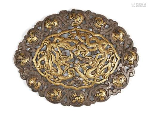 A Tibetan parcel-gilt silver dragon plaque, 14th/15th centur...