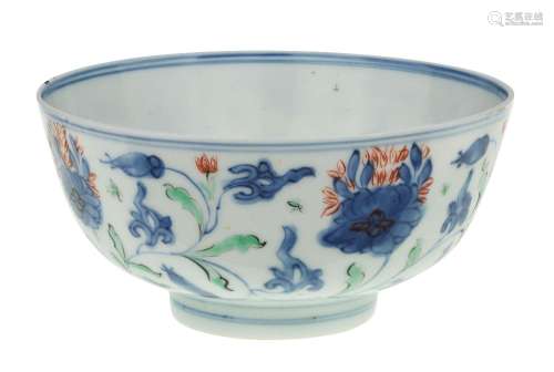 A Chinese doucai bowl, 18th century, painted with a continuo...