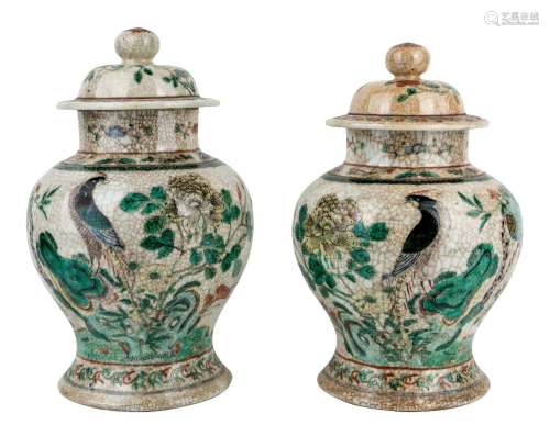A pair of Chinese famille verte jars and covers, late 19th c...