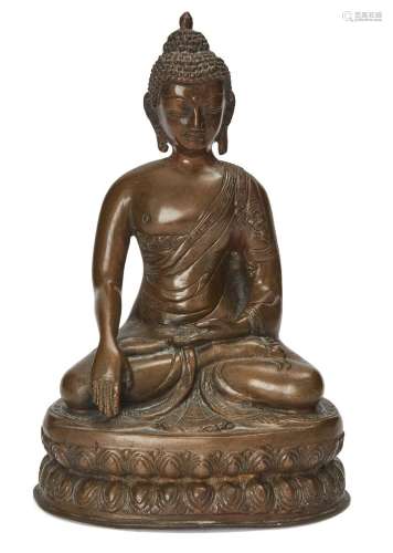 A Nepalese bronze Buddha, 18th century, cast sitting on a wa...