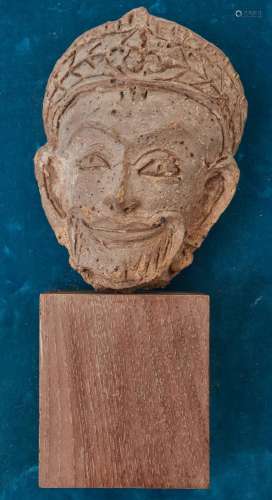 A Khmer terracotta head of a deity, Srivijava period, 7th-12...