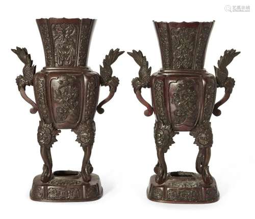 A pair of Japanese bronze vases, Meiji period, cast with alt...