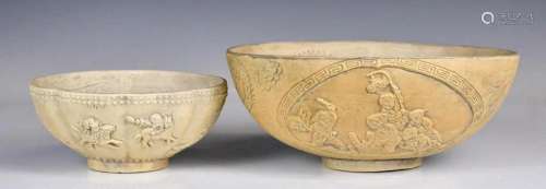 A Group of Two Pottery Carved Dragon Bowls