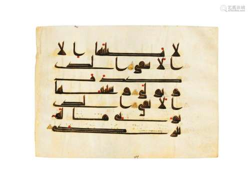 A QUR’AN FOLIO IN KUFIC SCRIPT ON VELLUM, NORTH AFRICA OR NE...