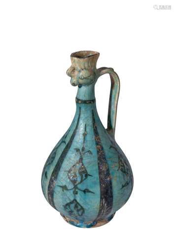 A KASHAN BLUE & BLACK GLAZED COCKEREL-HEAD POTTERY EWER ...