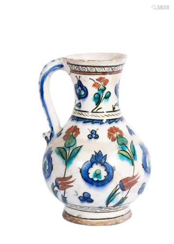 AN IZNIK POTTERY JUG OTTOMAN TURKEY, CIRCA 1575-80, 16TH CEN...