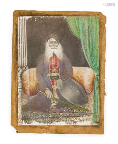 A PHOTOGRAPHIC & HAND PAINTED PICTURE OF A SEATED SHEIKH...