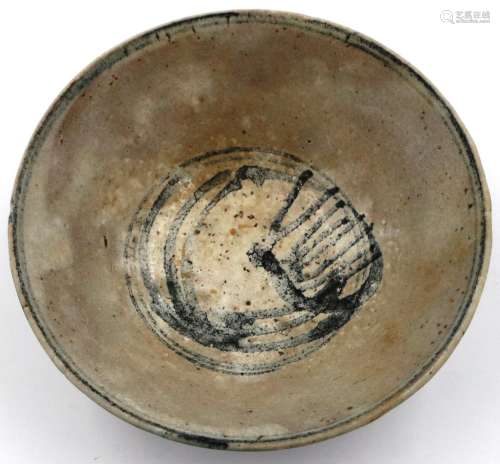 A Ming Dynasty glazed pottery bowl, footed and with painted ...