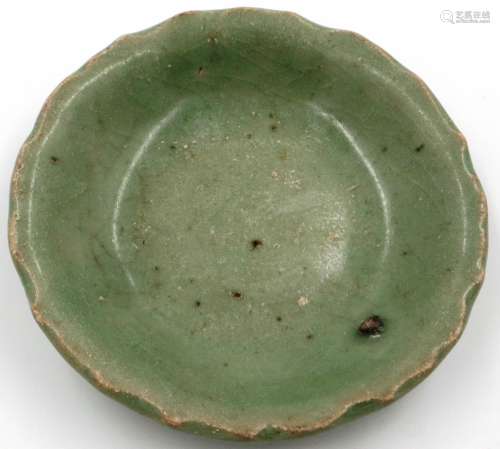 Ming Dynasty celadon shallow dish, having a wave border, imp...