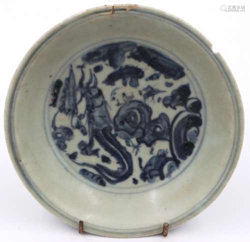 A Ming Dynasty glazed shallow bowl, with a painted circular ...