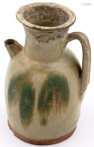 A Ming Dynasty glazed ewer, having unusual painted design to...