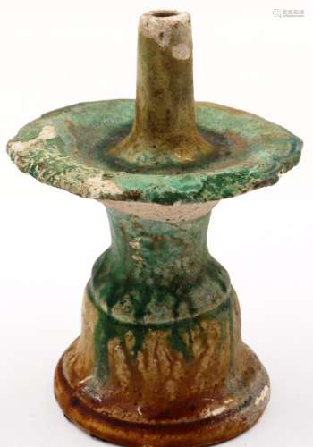 A Ming Dynasty glazed white clay taper stand, having a prick...