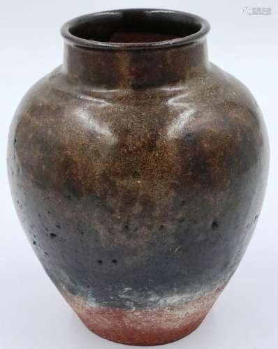 A late Tang Dynasty glazed jar, H: 18 cm. Glaze stops 4 cm s...