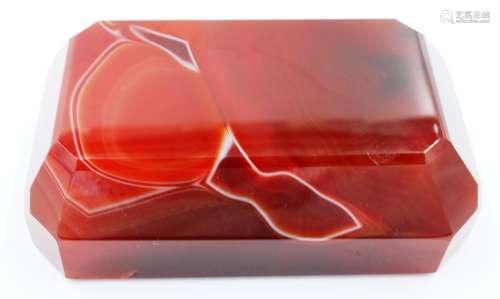 A banded and polished chuyu red agate block, with bevelled e...