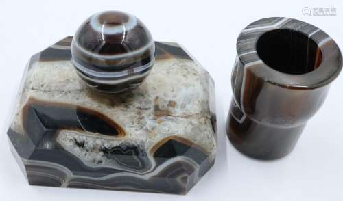 A banded and laced brown manao agate paperweight, being a ta...