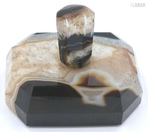 A banded and laced brown manao agate paperweight, being a ta...