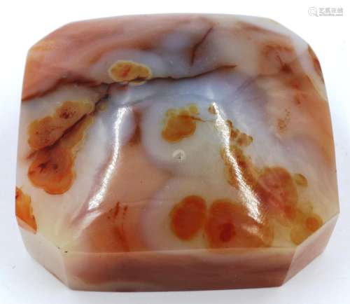 A domed block of unusual agate, mostly peach in colour with ...