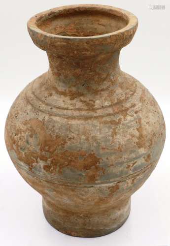 A Han Dynasty jar or Hu, of large proportions and with a rib...