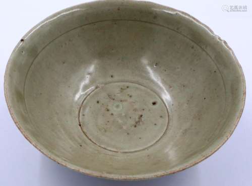 A Song Dynasty celadon glazed bowl, with incised patination ...