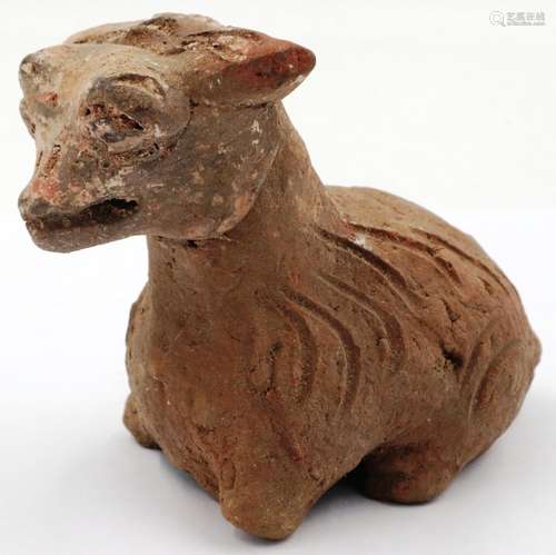 A Han Dynasty zoomorphic clay figure of a recumbent goat, H:...