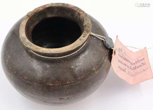 A Song Dynasty globular vessel, glazed in a mottled brown, w...