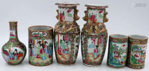 A pair of Canton vases, decorated with panels of figures wit...