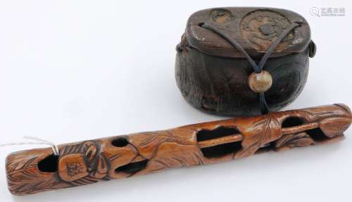 A Japanese Meiji period carved wood single-case inro, set wi...