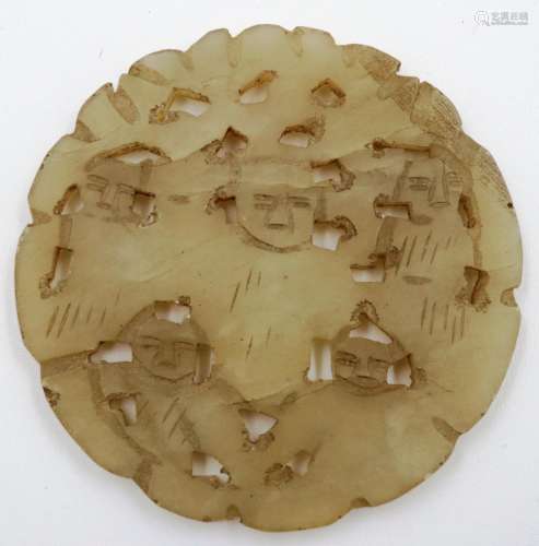 Carved white jade pendant with naïve carved faces to each si...