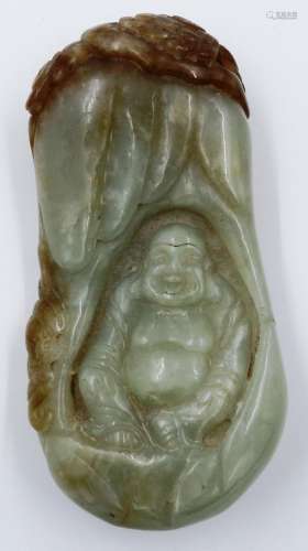 A pale celadon and brown jade carved seated buddha within a ...