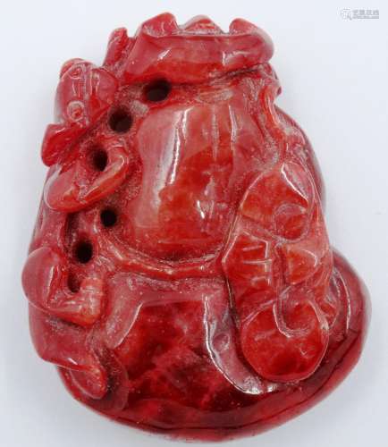 A carved red jade panel, decorated with a prowling leopard, ...