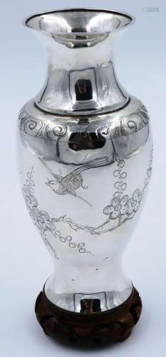 An early 20th century Chinese silver vase decorated with bir...