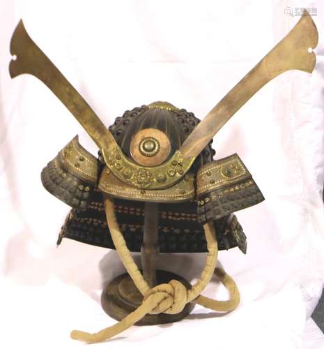 A Japanese Meiji period Kabuto with lacquered brass mounts a...