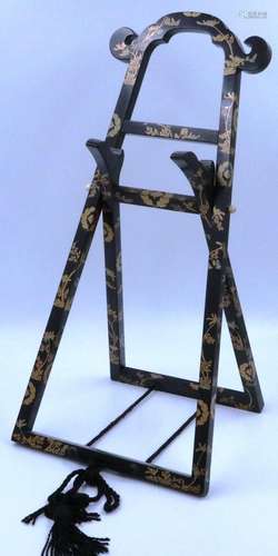 A 19th century Japanese lacquered mirror easel, folding, wit...