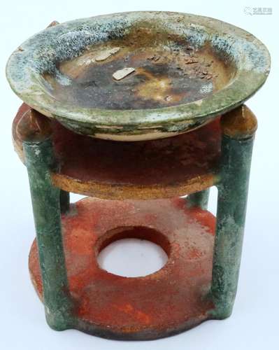 A Ming Dynasty glazed circular alter stand with offering dis...