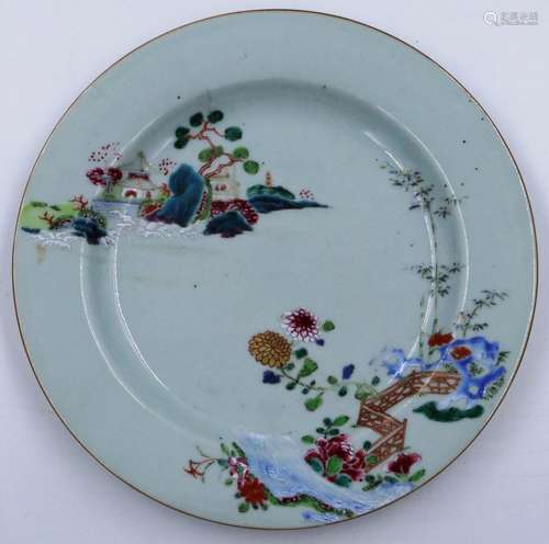 An 18th century ceramic plate painted with floral design wit...