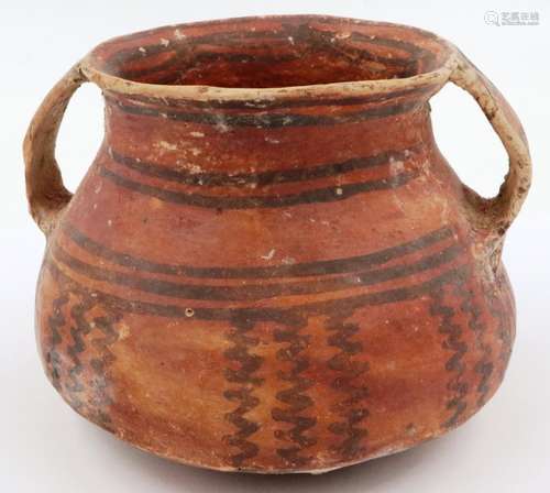 A Neolithic period vessel, having twin incorporated handles ...