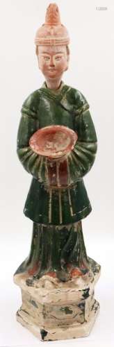 A Ming Dynasty attendant figure, of large stature and raised...