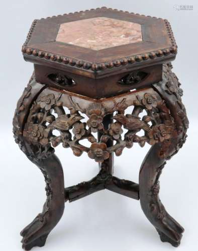 A padouk wood profusely carved vase stand, the top inset wit...