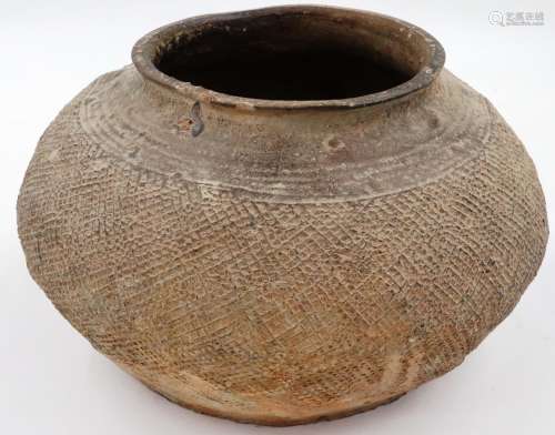 Eastern Han Dynasty fired clay jar, the wide body with incis...