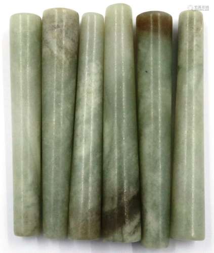 Seven turned and polished jade conical pillars or grips, H: ...