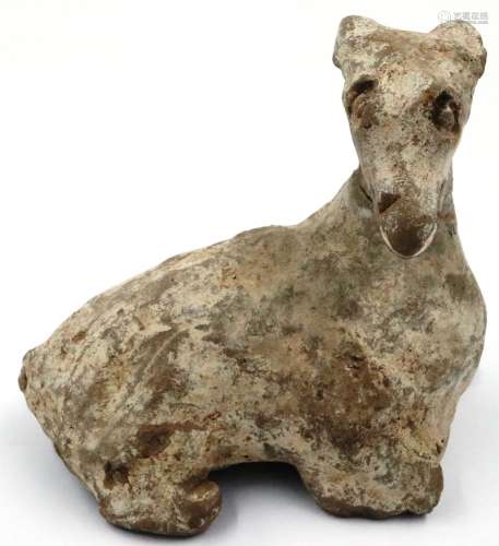 A Ming Dynasty zoomorphic clay lamb ornament, its features i...
