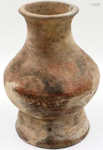 A Chinese Neolithic period vessel, retaining some of its pol...