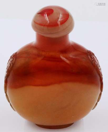 A carved and polished agate snuff bottle, of moon form with ...