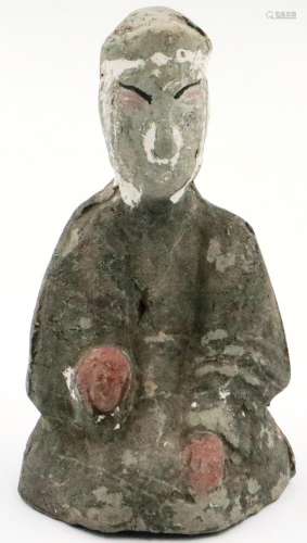 A Han Dynasty grey clay kneeling guardian, retaining most of...