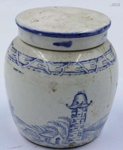 An early 19th century covered jar, decorated in blue with de...