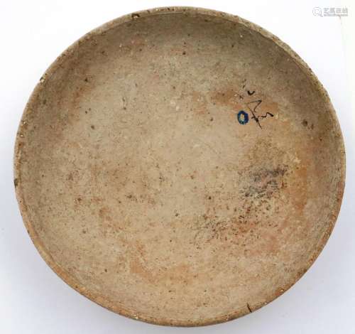 A Han Dynasty shallow bowl, terracotta and tapering to a cir...