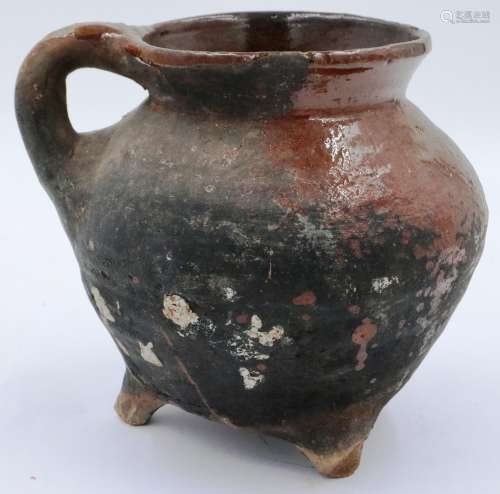 A Song Dynasty? brown glazed ewer or jar raised on three fee...