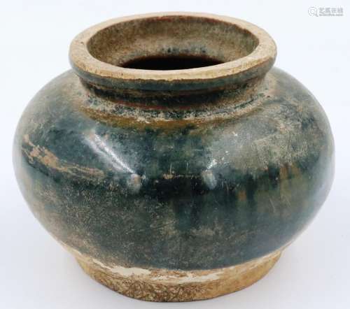 A Song Dynasty glazed jar or vessel, having a squat form bod...
