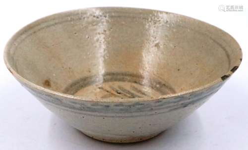 A Ming Dynasty glazed bowl, decorated with a dark blue scrip...