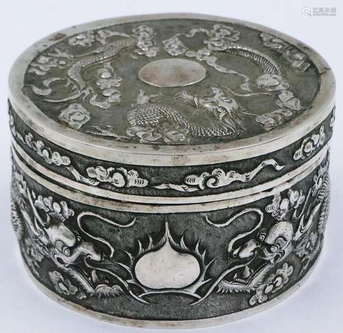 A Chinese export silver circular box and cover, profusely de...